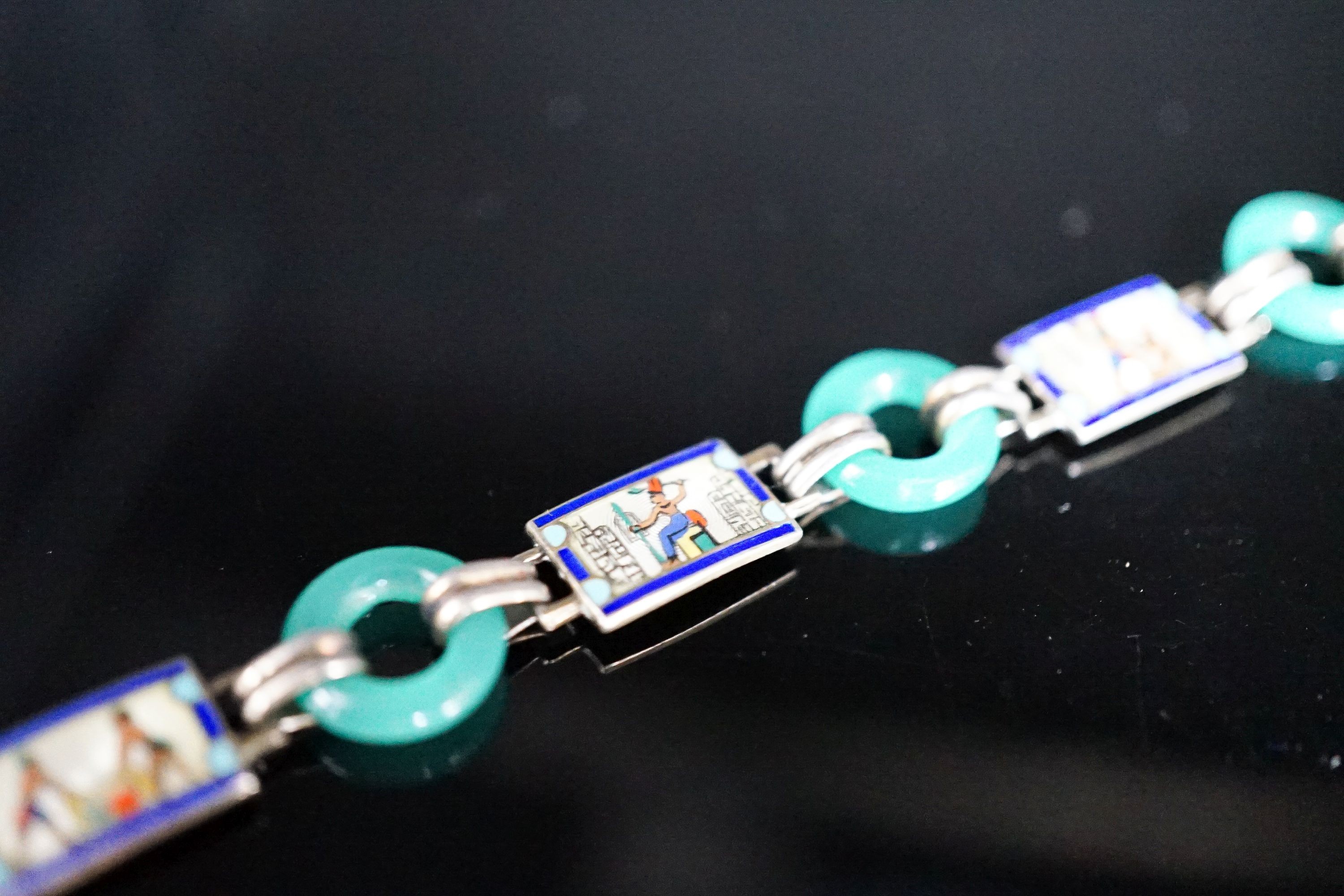 A 20th century Egyptianesque gilt white metal, enamel and chrysoprase loop set bracelet, 18cm.